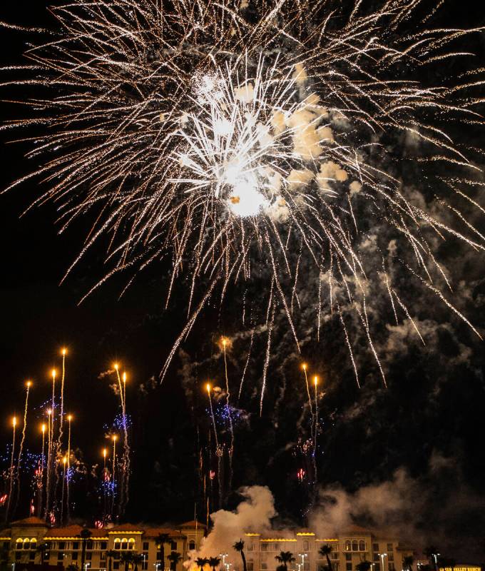 Fireworks go off above the Green Valley Ranch, on Sunday, July 4, 2021, in Henderson. (Bizuayeh ...