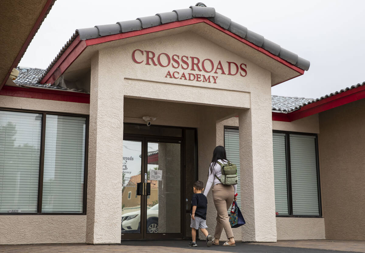 A boy is dropped off at the Crossroads Academy preschool on Wednesday, June 7, 2023, in Las Veg ...