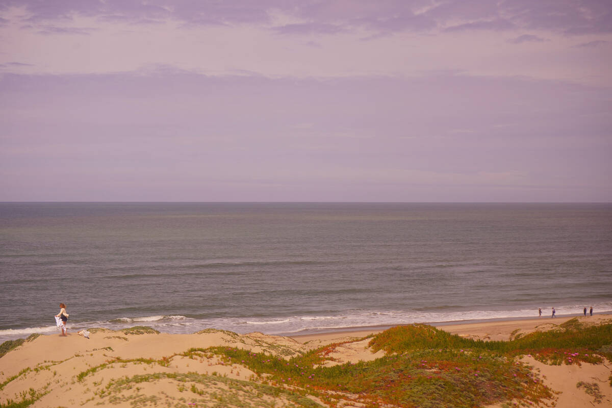 Beachgoers seen from the Pacific Surfliner on the 80-mile stretch of track between Santa Barbar ...