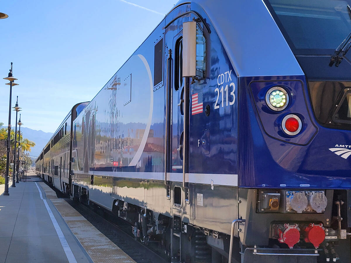 Pacific Surfliner arriving at Santa Barbara station to pick up San Luis Obispo-bound passengers ...