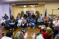 World War II veterans pose for a photo after a ceremony commemorating the 75th anniversary of t ...