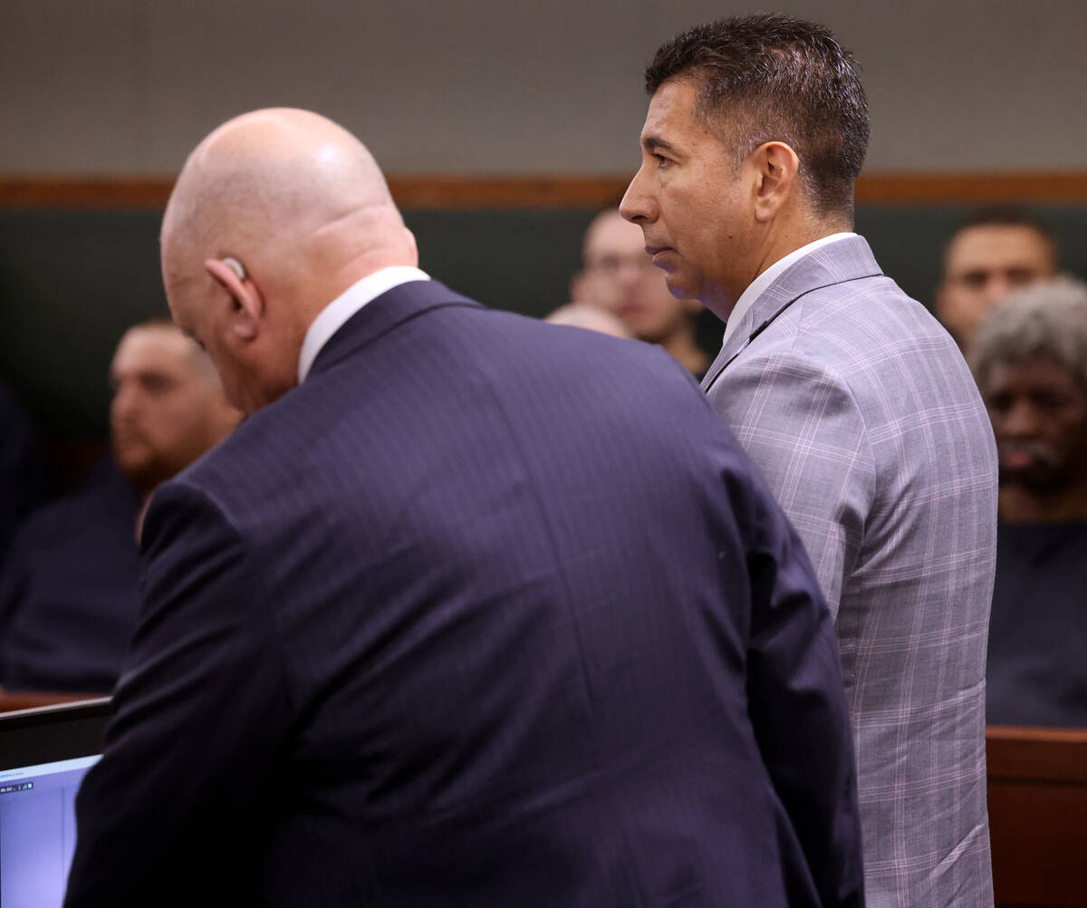 Former Alpine Motel Apartments owner Adolfo Orozco-Garcia, right, appears in Clark County Distr ...