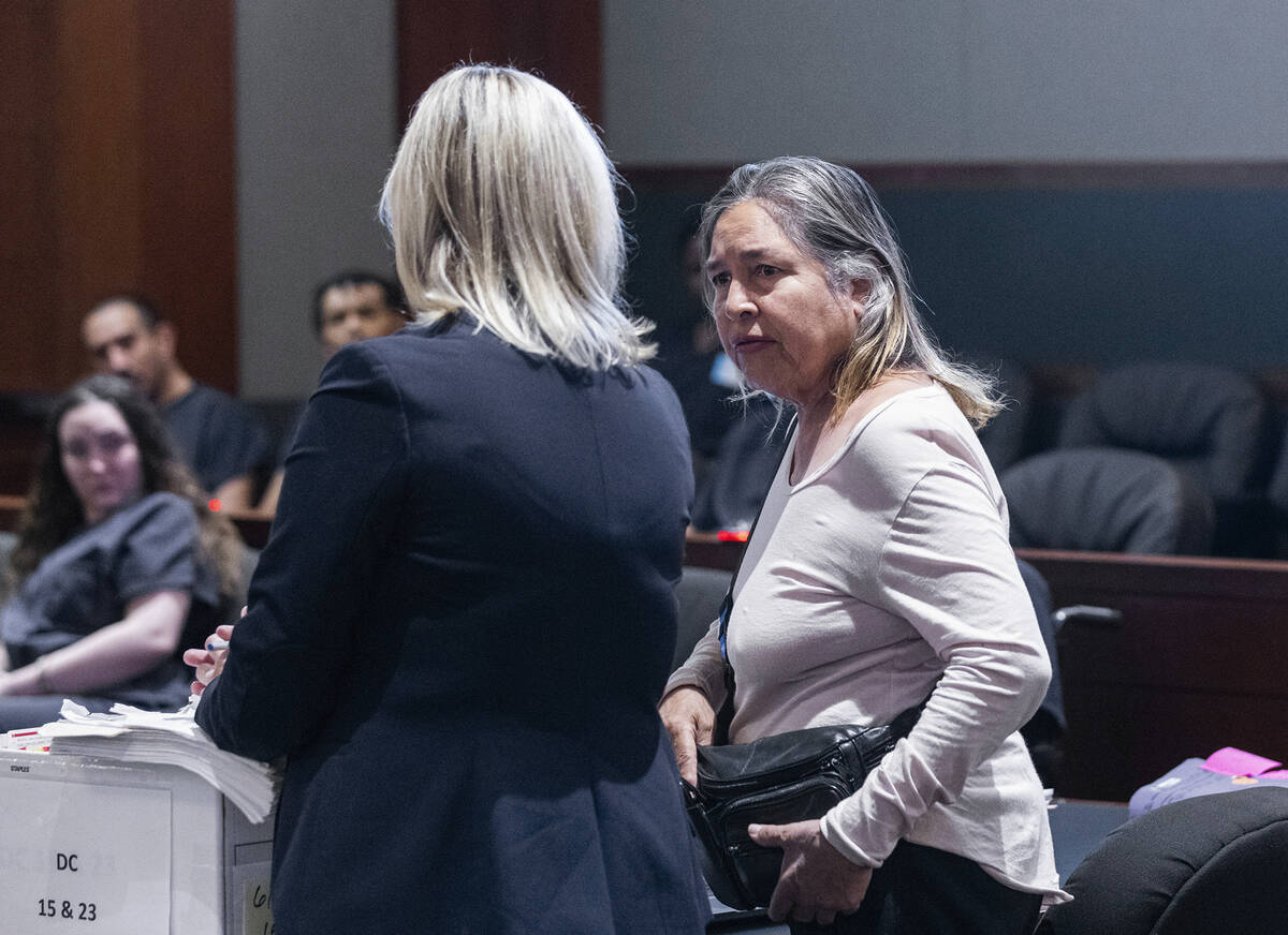 Cecilia Stern speaks to Chief Deputy District Attorney Colleen Baharav, left, before delivering ...
