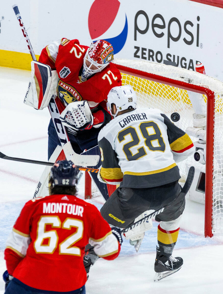 Florida Panthers goaltender Sergei Bobrovsky (72) deflects a shot with Golden Knights left wing ...