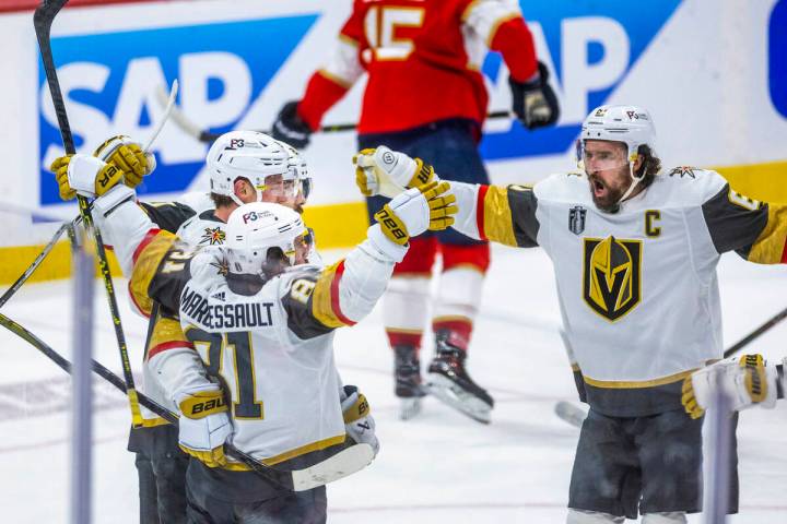 Golden Knights right wing Mark Stone (61) comes to celebrate a goal with right wing Jonathan Ma ...