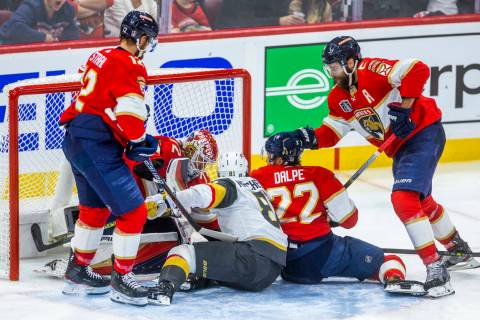 Golden Knights right wing Jonathan Marchessault (81) gets caught in the scrum as Florida Panthe ...