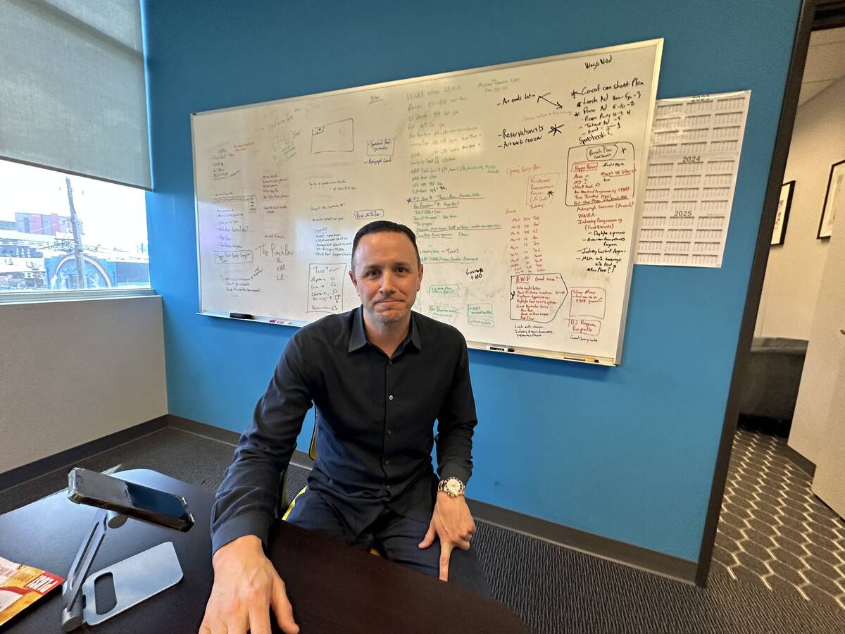 Sean Christie is shown in front of his idea-laden white board his office in the Arts District i ...