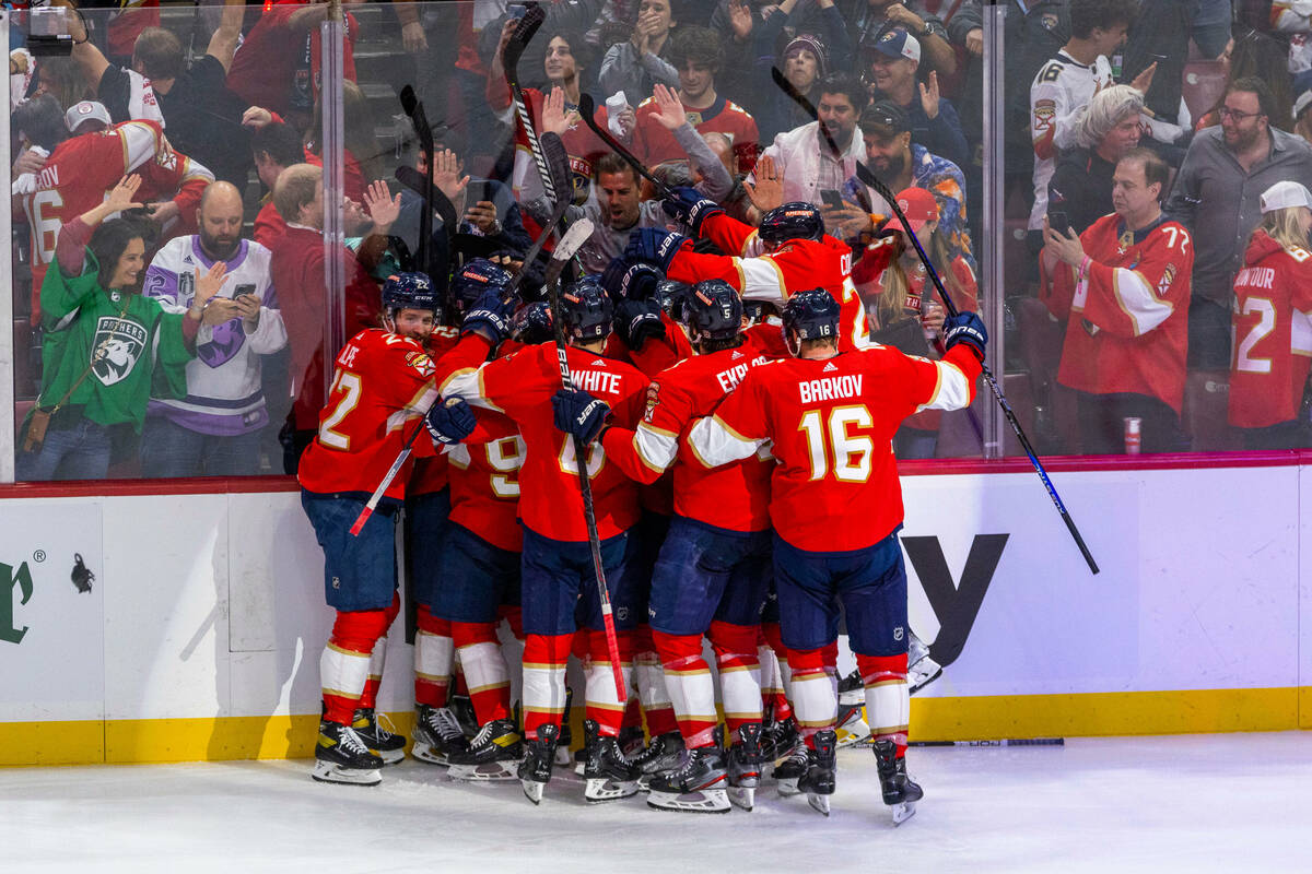 Florida Panthers players celebrate after defeating the Golden Knights 3-2 in an overtime period ...