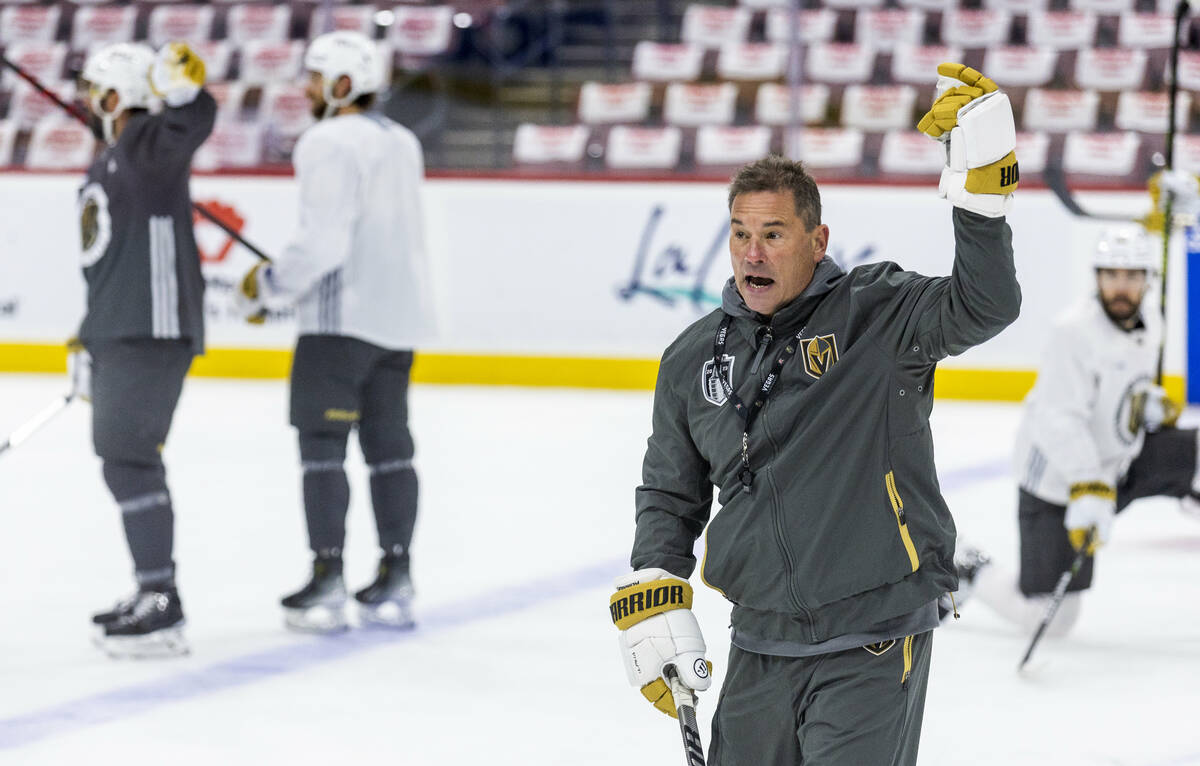 Golden Knights head coach Bruce Cassidy yells instructions to his players practice during the m ...