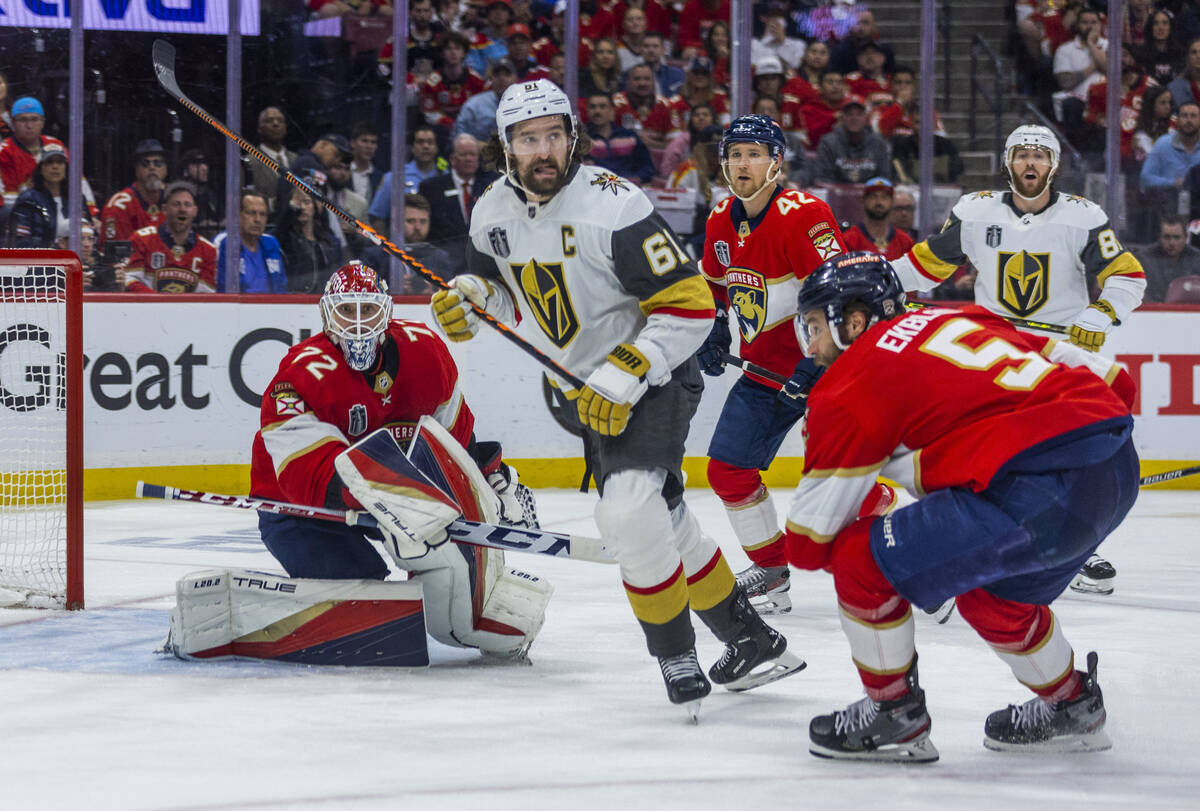 Golden Knights right wing Mark Stone (61) looks for a pass defended by Florida Panthers defense ...