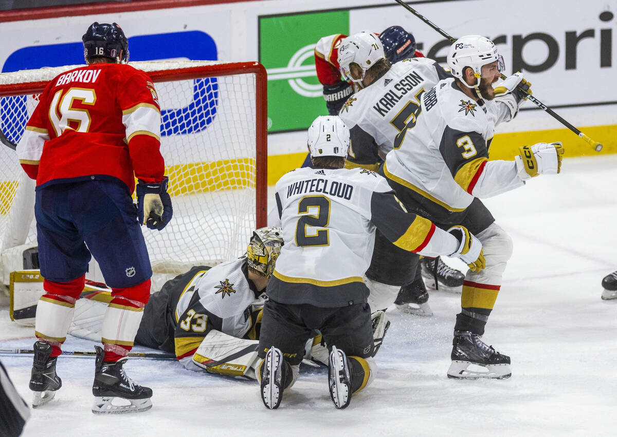Golden Knights defenseman Brayden McNabb (3) begins to celebrate the win as fights break out ag ...