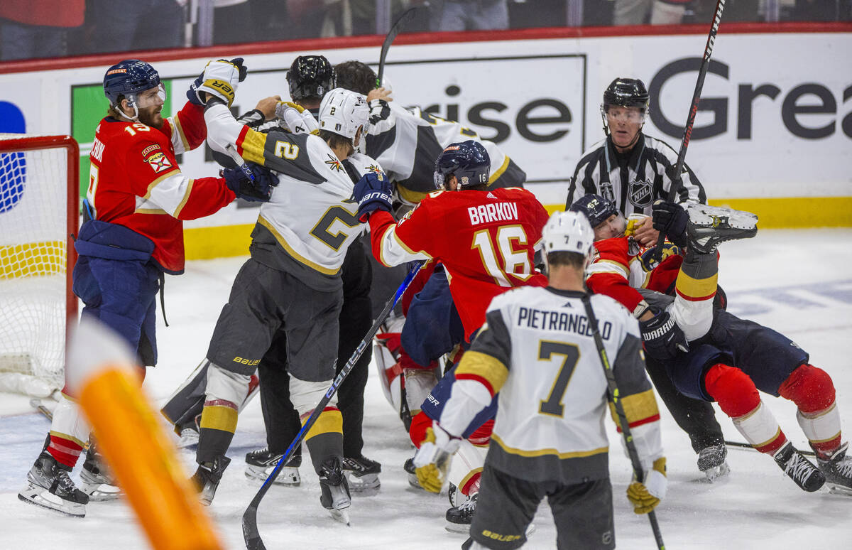 Golden Knights and Florida Panthers players fight as the game ends after period 3 of Game 4 of ...