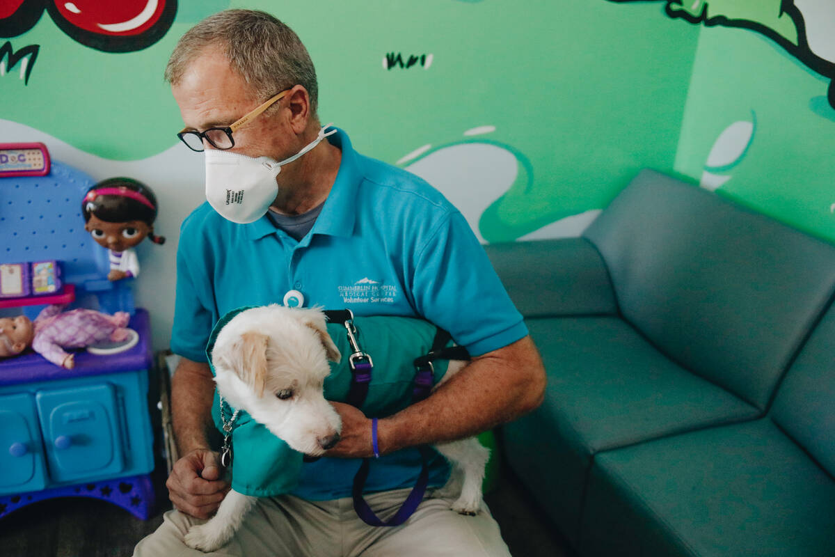 Rick Williams holds his dog, Deke Henri Furry, on Friday, June 9, 2023, at Summerlin Hospital i ...