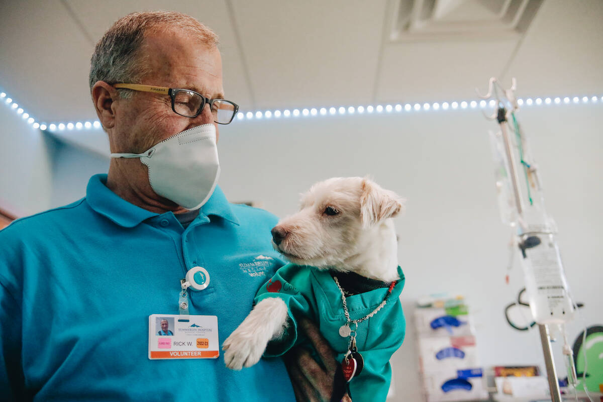 Rick Williams holds his dog, Deke Henri Furry, on Friday, June 9, 2023, at Summerlin Hospital i ...