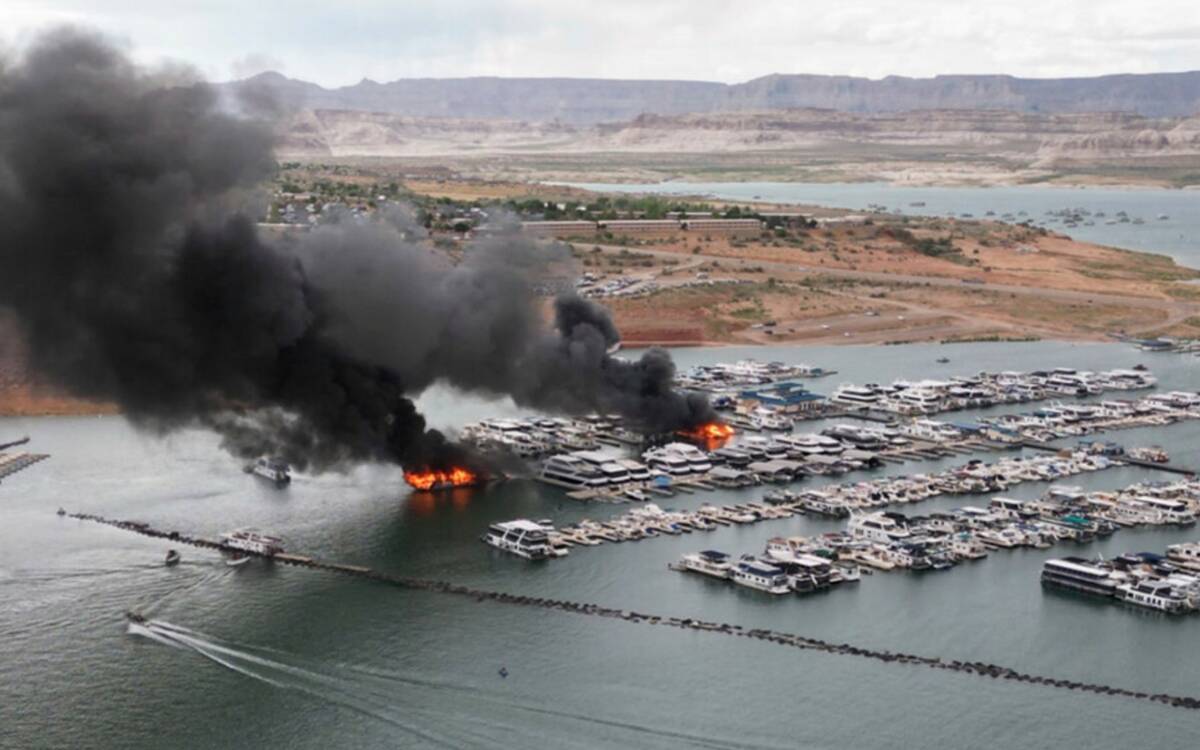 A houseboat fire is seen in Wahweap Marina on Lake Powell, Friday, June 2, 2023, near Page, Ari ...