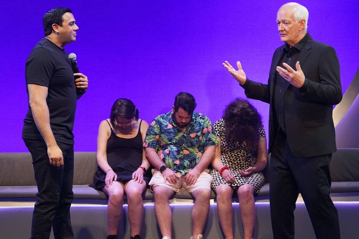 Asad Mecci and Colin Mochrie are shown in a performance of “Hyprov: Improv Under Hypnosis," a ...