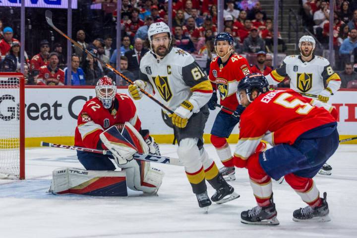 Golden Knights right wing Mark Stone (61) looks for a pass defended by Florida Panthers defense ...