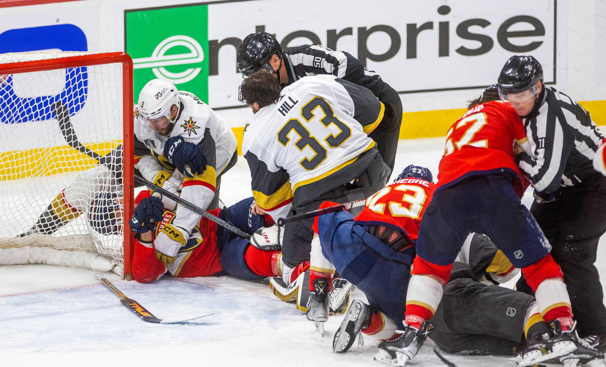 Golden Knights and Florida Panthers players fight as the game ends after period 3 of Game 4 of ...