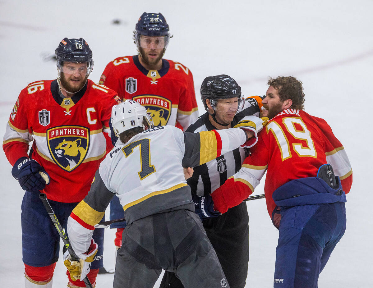 Golden Knights defenseman Alex Pietrangelo (7) fights with Florida Panthers left wing Matthew T ...