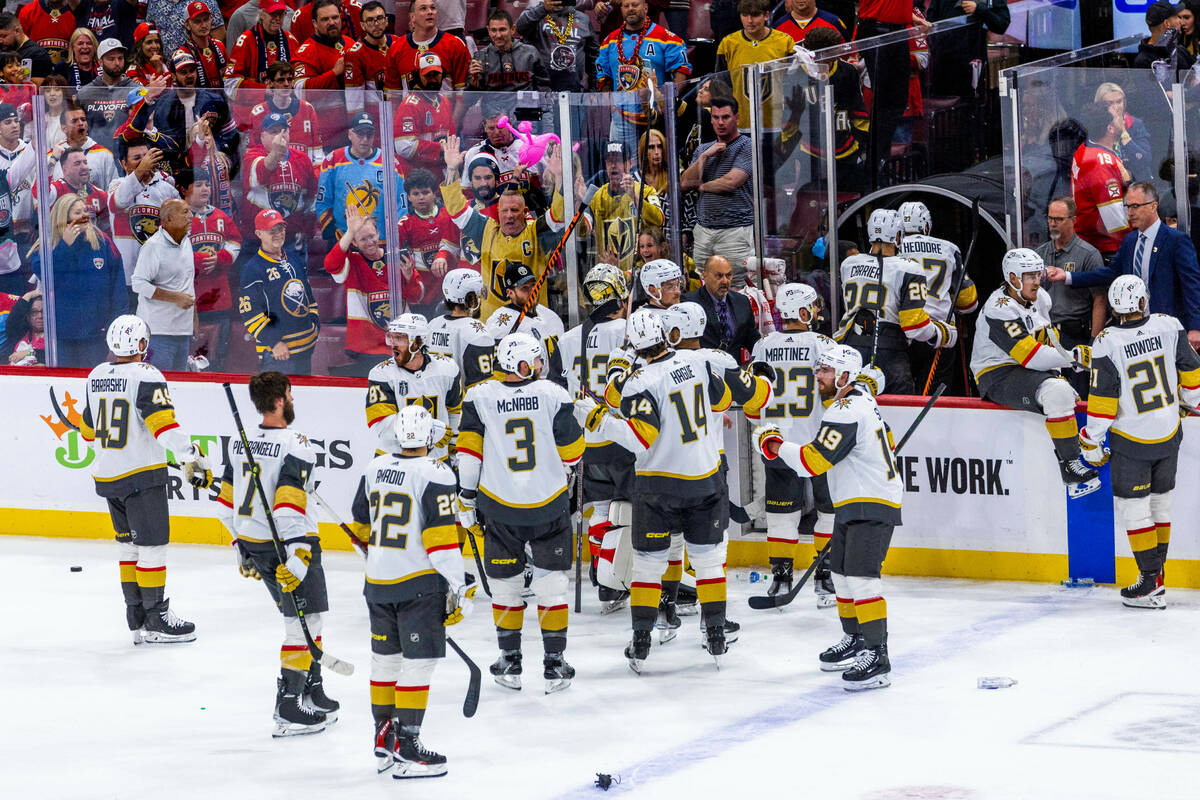 Golden Knights players are congratulated by their fans after their 3-2 win against the Florida ...