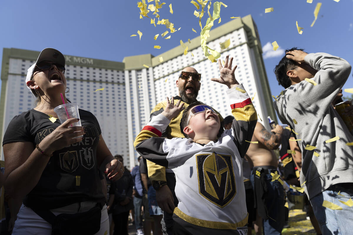 Golden Knights fan Lincoln Utrecht, 7, center, throws confetti in the air before Game 5 of the ...