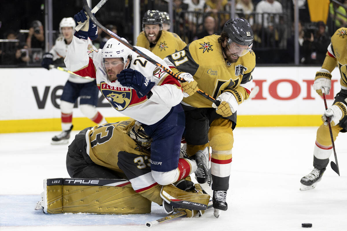 Florida Panthers center Nick Cousins (21) and Golden Knights right wing Mark Stone (61) fall in ...