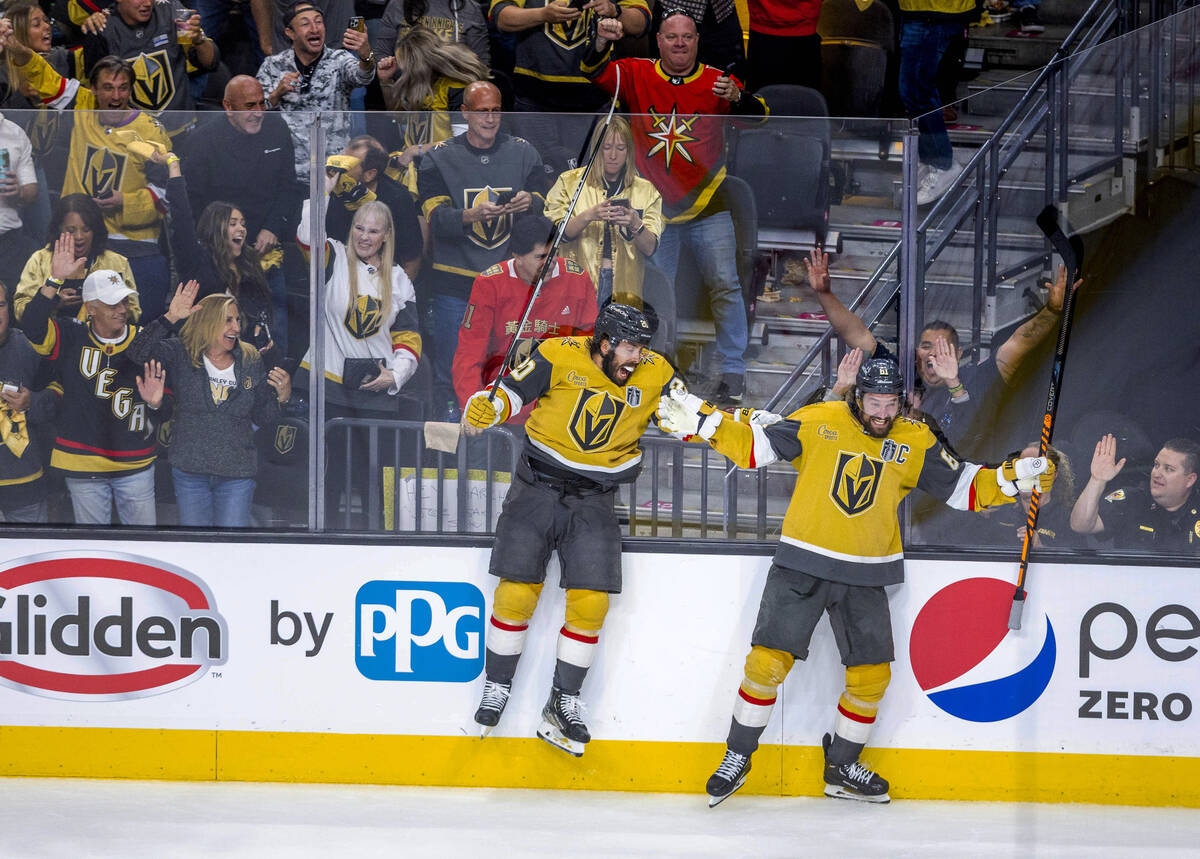 Golden Knights center Chandler Stephenson (20) and right wing Mark Stone (61) celebrate a score ...