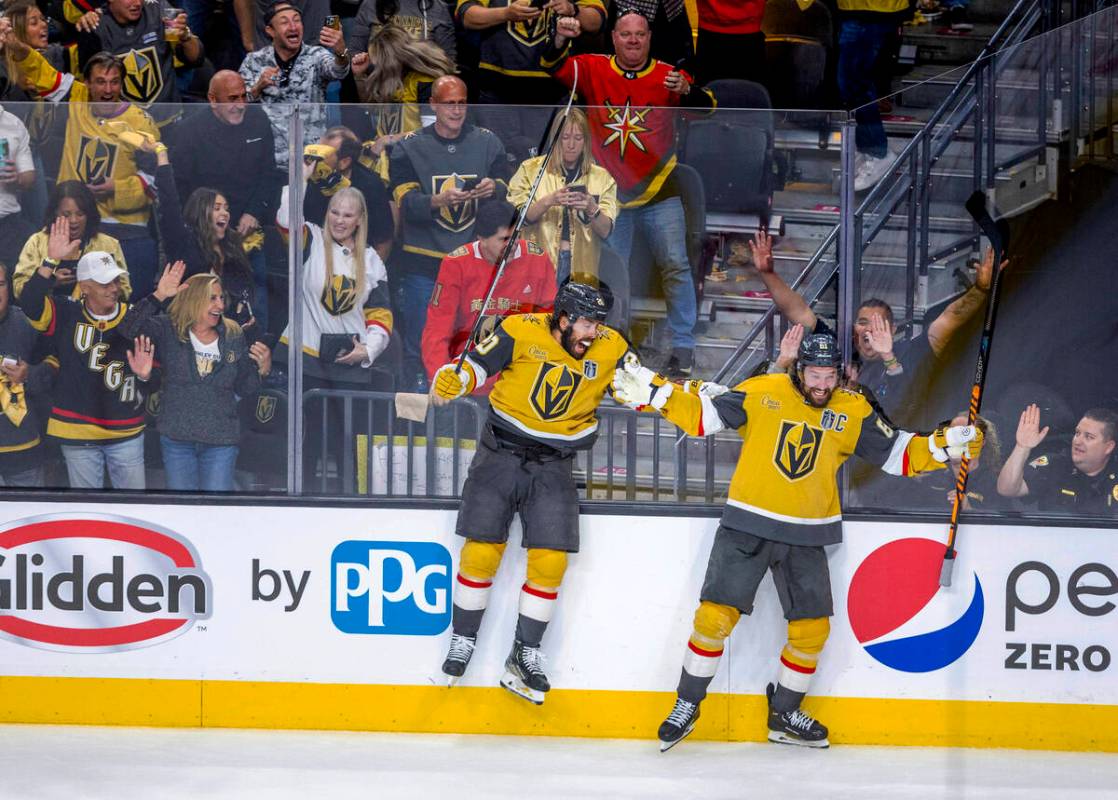Golden Knights center Chandler Stephenson (20) and right wing Mark Stone (61) celebrate a score ...