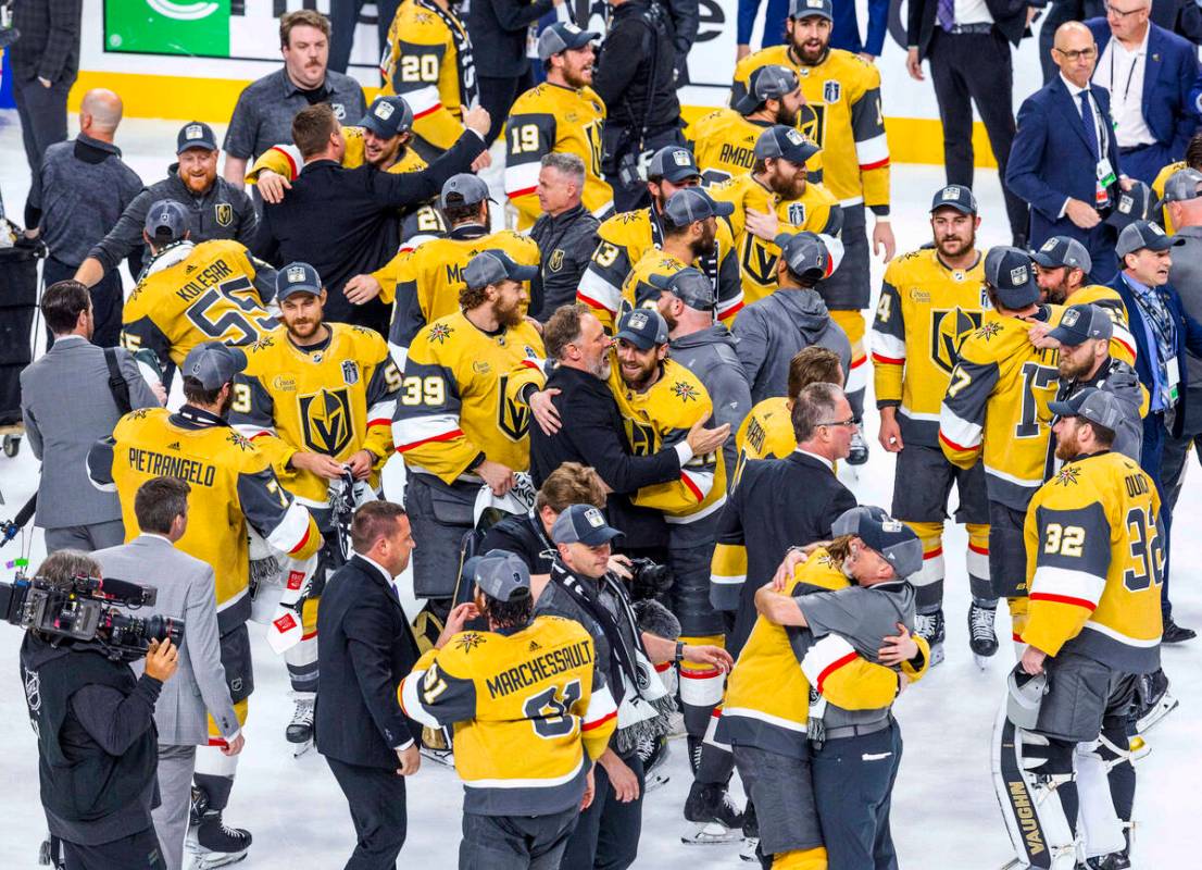 Golden Knights players, coaches and staff celebrate after their 9-3 win over the Florida Panthe ...