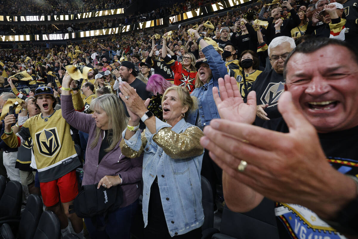 Golden Knights fans celebrate after Golden Knights right wing Reilly Smith (19) scored a goal d ...