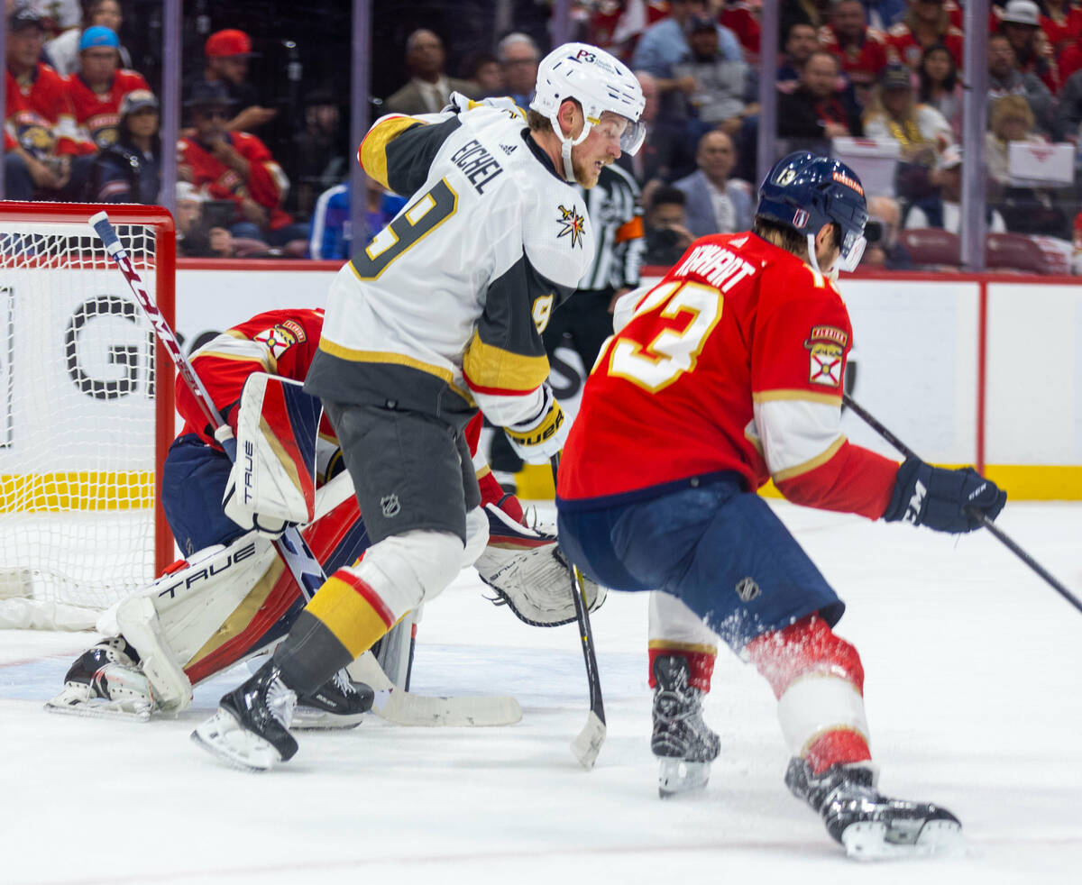 Golden Knights center Jack Eichel (9) looks to receive the puck against Florida Panthers center ...