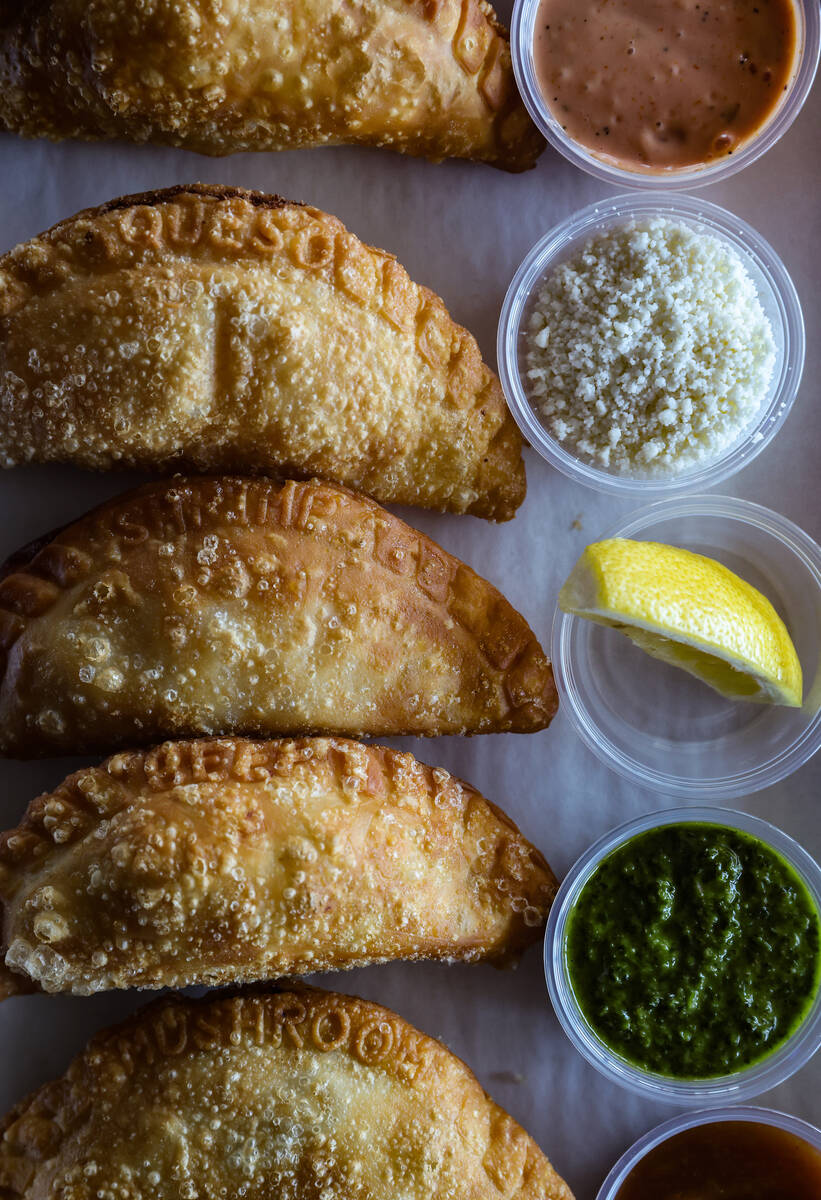 The empanada flight with beef, chicken, queso, shrimp and spicy mushroom empanadas at Makers & ...