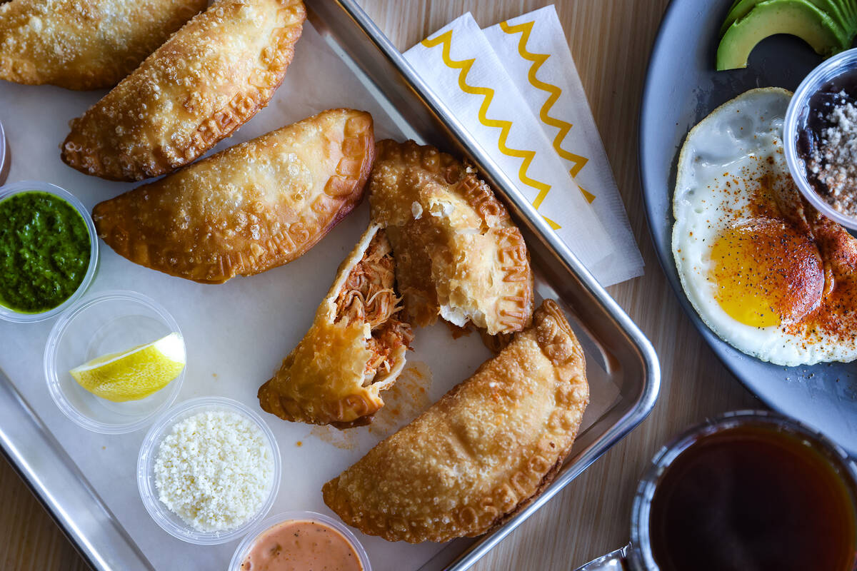 The empanada flight with beef, chicken, queso, shrimp and spicy mushroom empanadas at Makers & ...