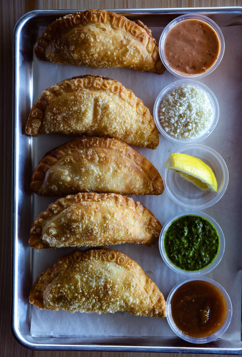 The empanada flight with beef, chicken, queso, shrimp and spicy mushroom empanadas at Makers & ...