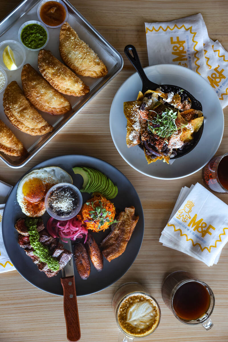 Clockwise from left: bandeja paisa, empanada flight, and chilaquiles at Makers & Finders in He ...