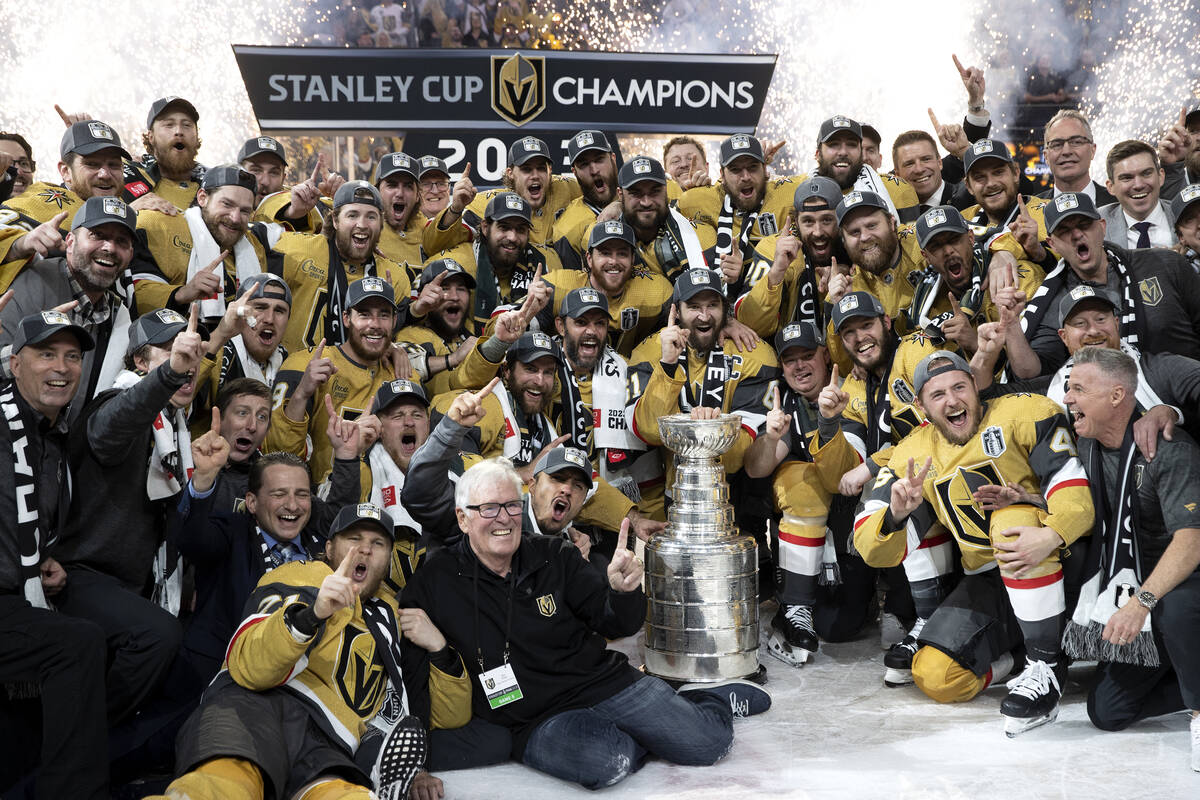 Golden Knights players celebrate with the Stanley Cup trophy