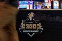 A person walks by a banner for the BetMGM Poker Championship at the Aria on Wednesday, June 22, ...