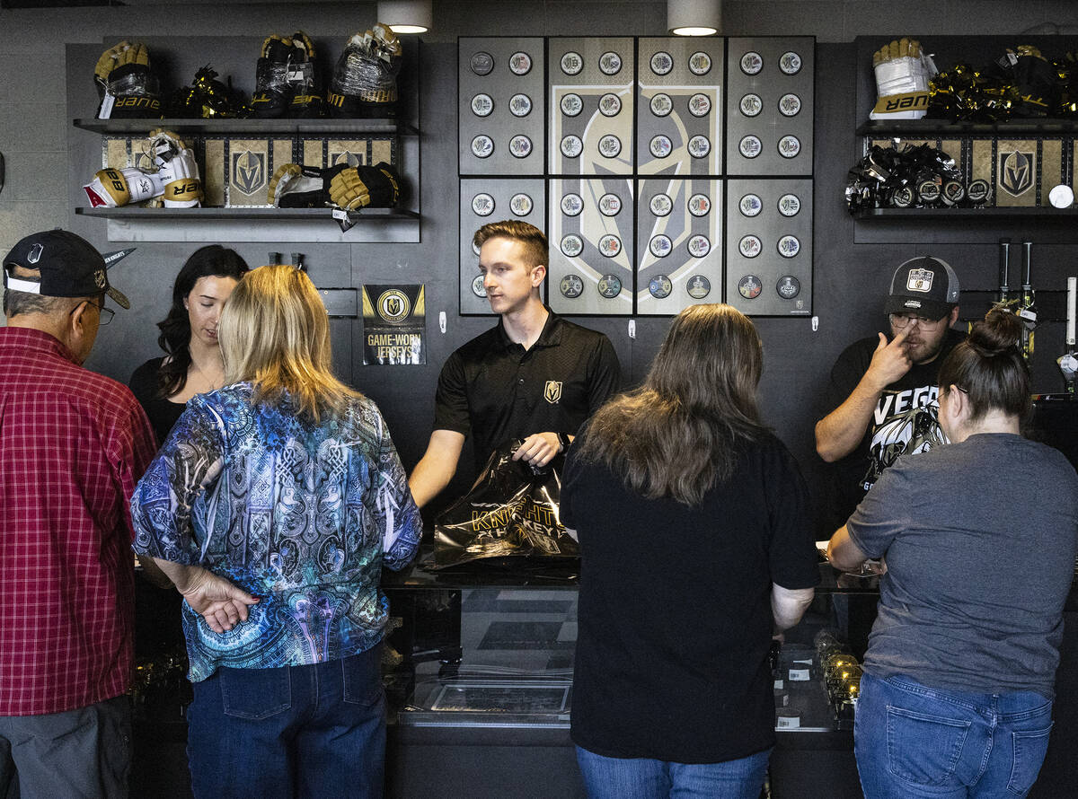 Golden Knights fans check out their Stanley Cup championship merchandise at The Arsenal at City ...