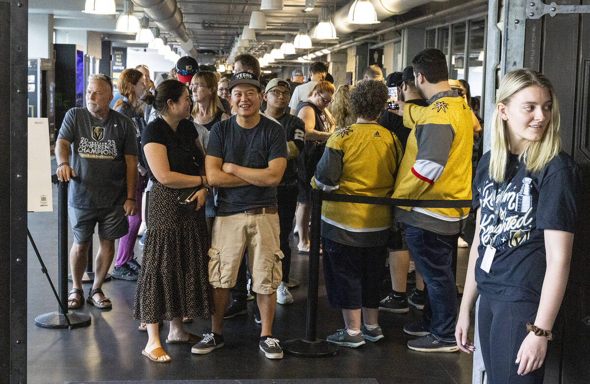 Golden Knights fans line up to buy Stanley Cup championship merchandise at The Arsenal at City ...