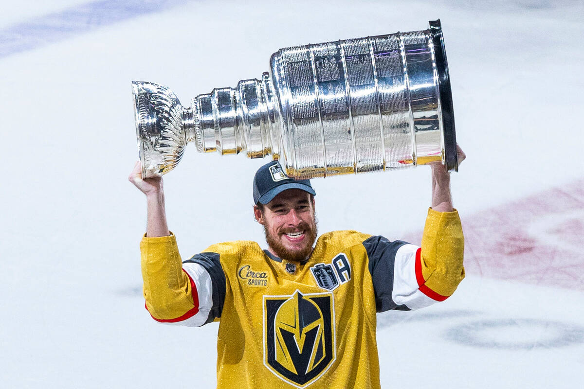 Golden Knights right wing Reilly Smith (19) hoists the Stanley Cup after defeating the Florida ...