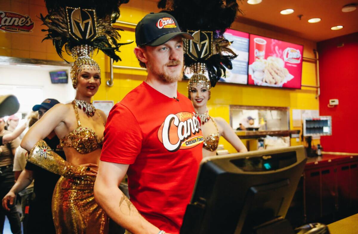Golden Knights center Jack Eichel takes orders from fans inside of Raising Canes on Friday, Jun ...