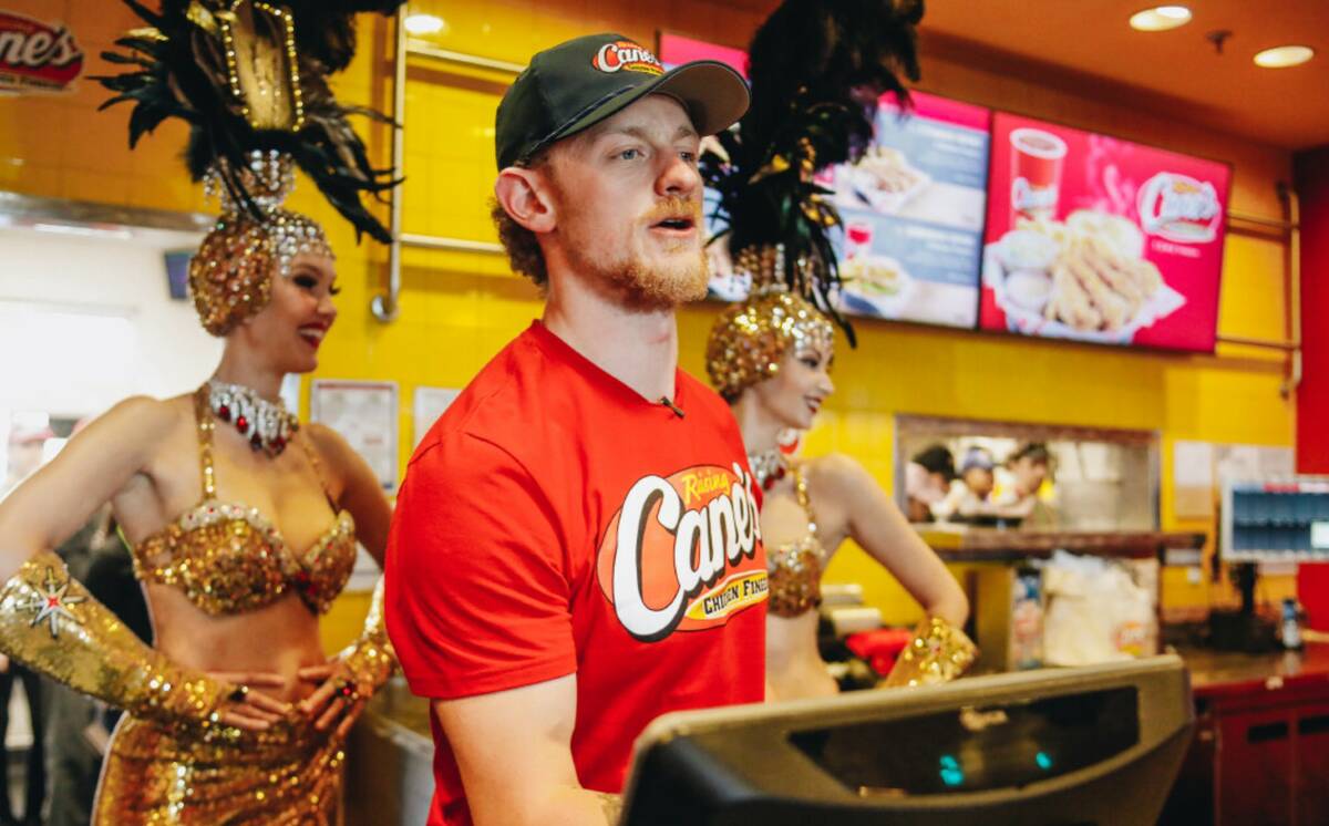 Golden Knights center Jack Eichel takes orders from fans inside of Raising Canes in Las Vegas. ...