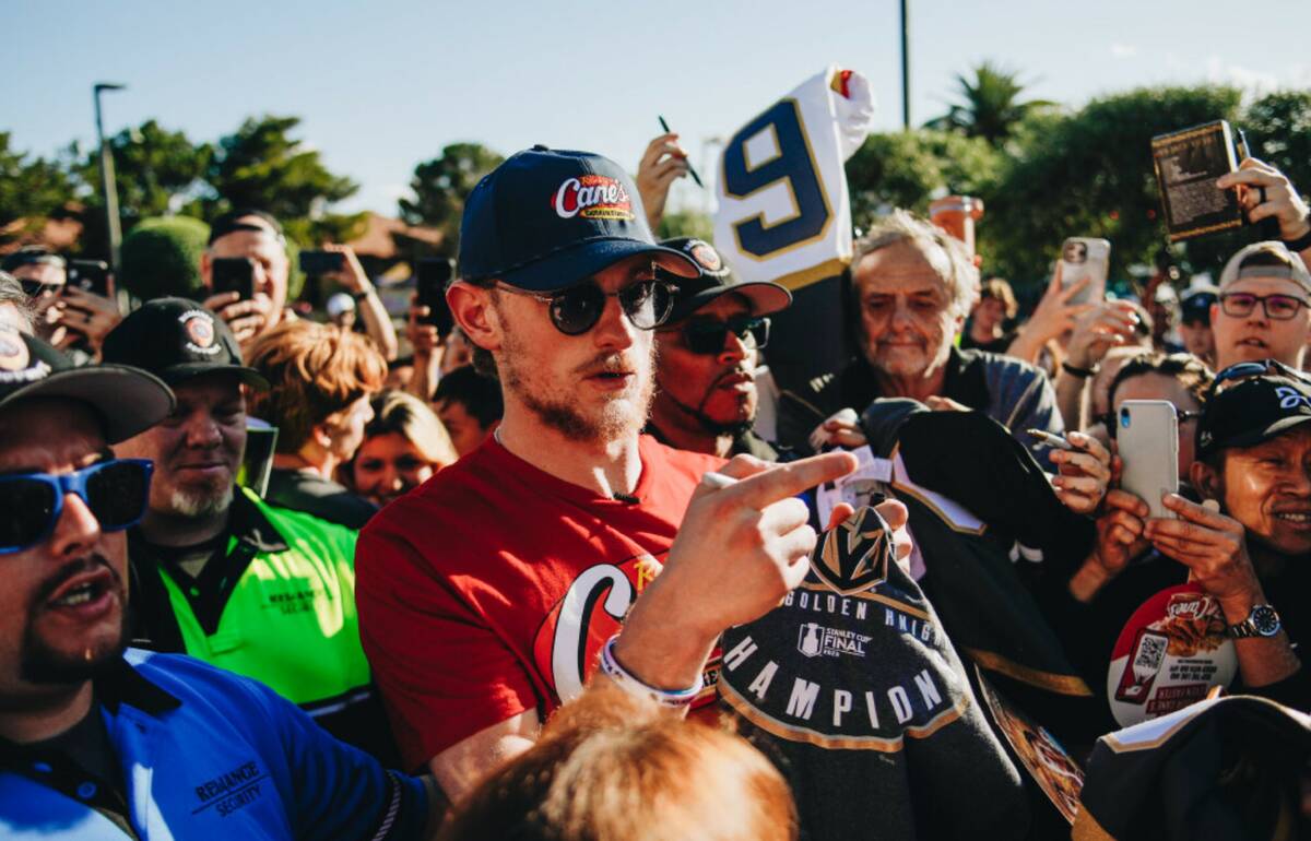 Golden Knights center Jack Eichel is surrounded by fans on Friday, June 16, 2023, outside of Ra ...