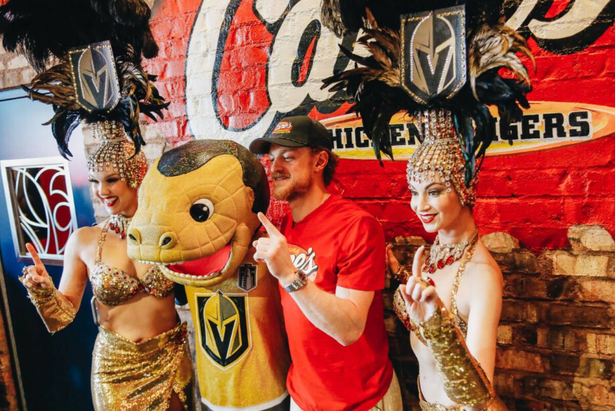 Golden Knights center Jack Eichel poses with showgirls and Chance the mascot on Friday, June 16 ...