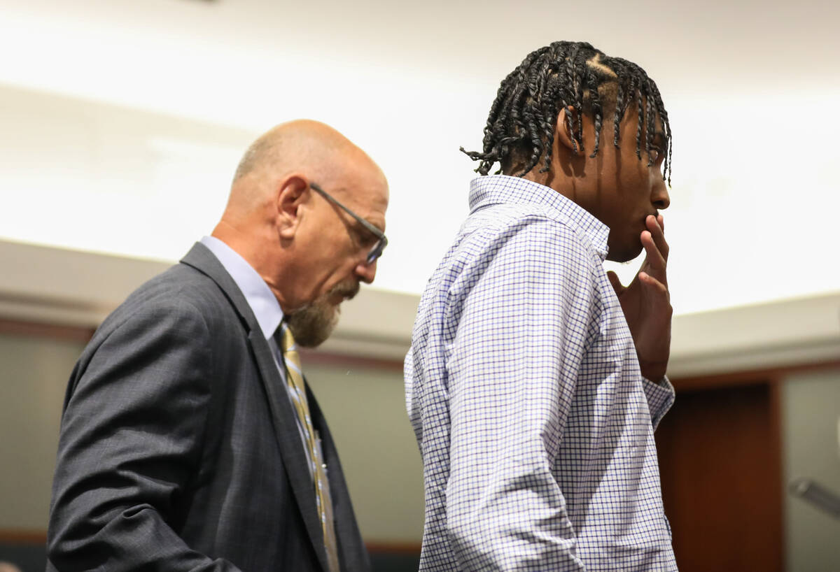 Former UNLV basketball recruit Zaon Collins alongside his attorney, Frank Kocka, waits to enter ...