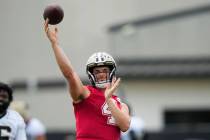 New Orleans Saints quarterback Derek Carr (4) passes during an NFL football practice in Metairi ...