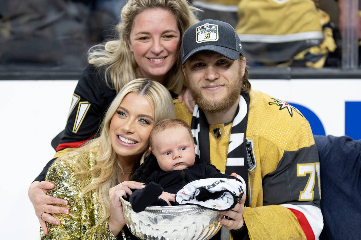 Golden Knights center William Karlsson (71) poses with his family, wife Emily Karlsson, bottom ...