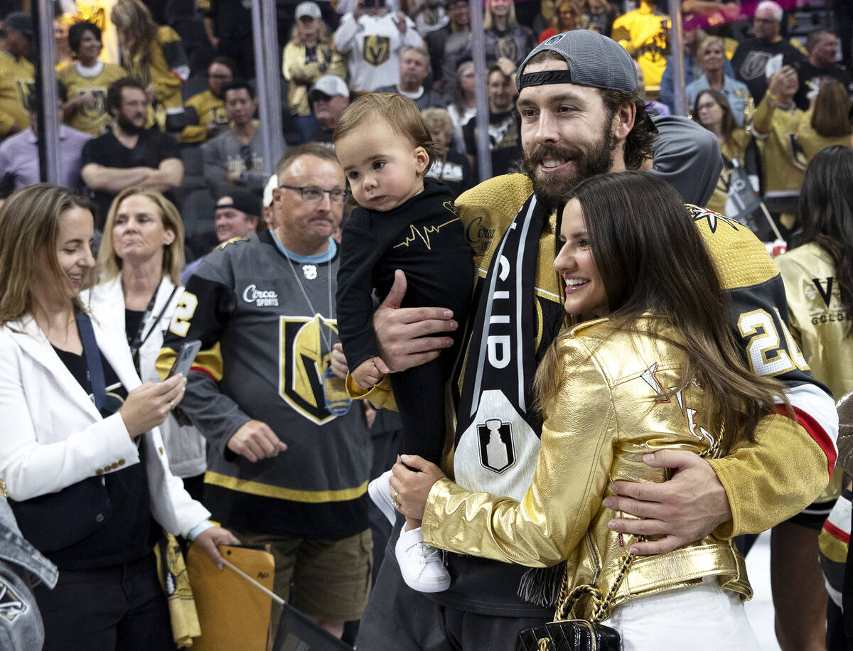 Golden Knights center Chandler Stephenson (20) poses with his son, Ford Stephenson, and fiancee ...