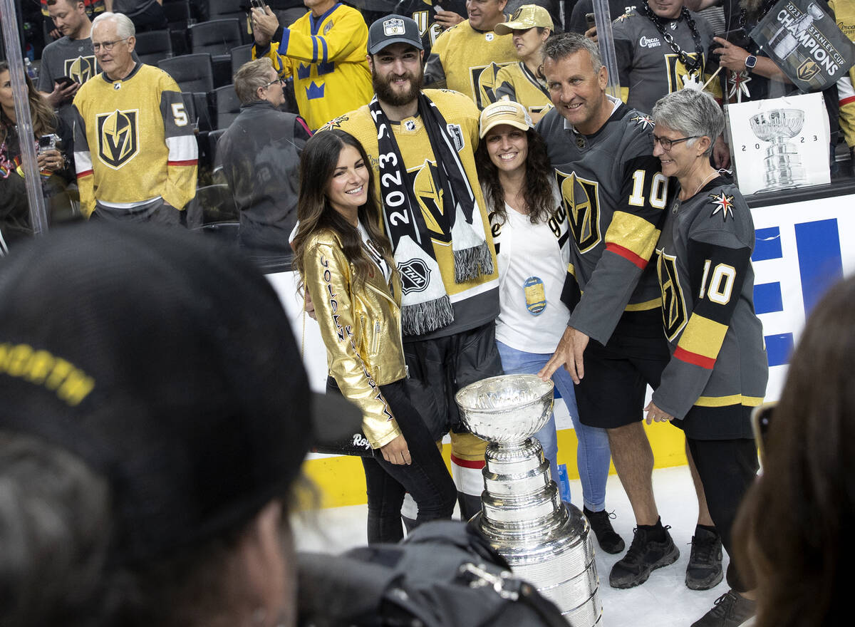 Golden Knights center Nicolas Roy (10) poses for a photo with his family and the Stanley Cup af ...