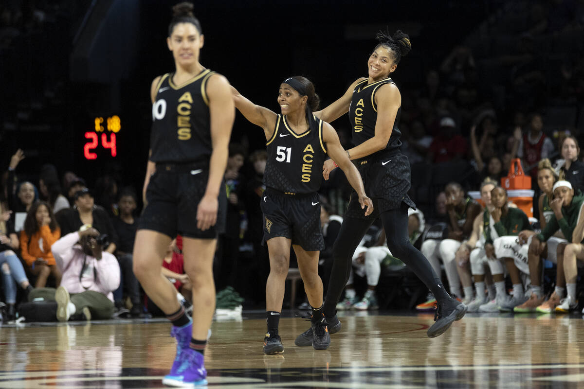 Las Vegas Aces guard Kelsey Plum (10), guard Sydney Colson (51) and forward Candace Parker, rig ...